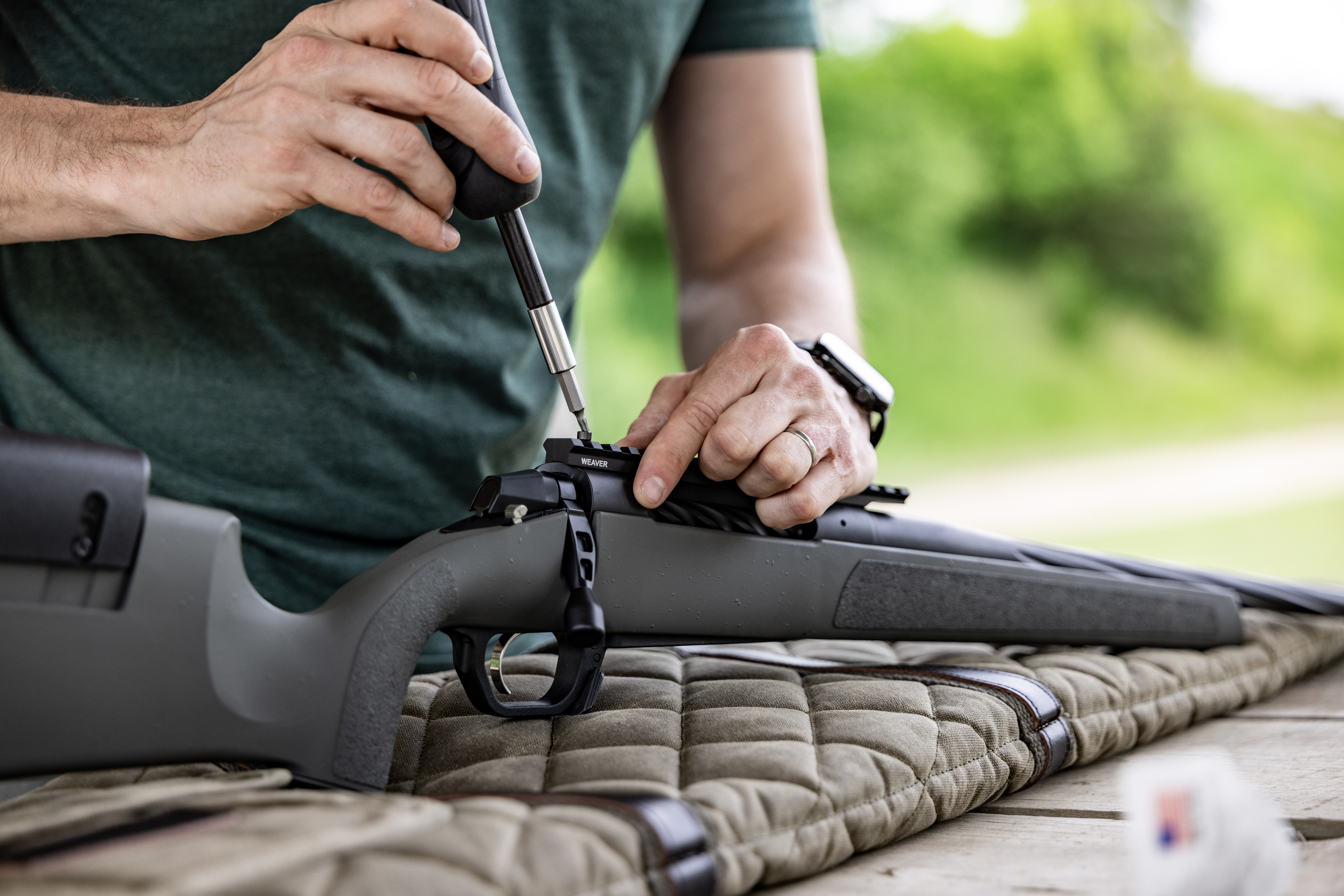 Shooter zeroing rifle at range