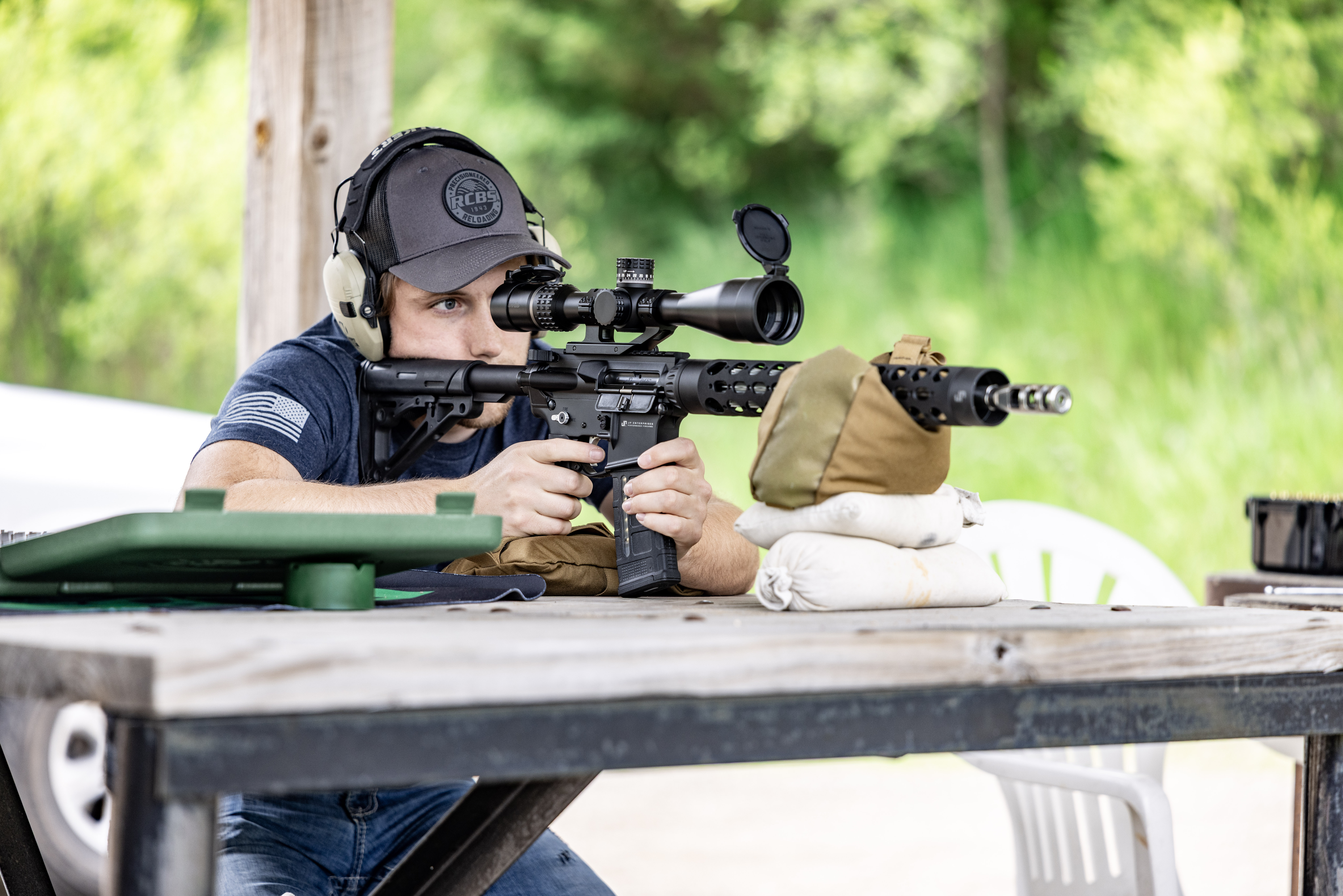 Rifle with scope on shooting rest